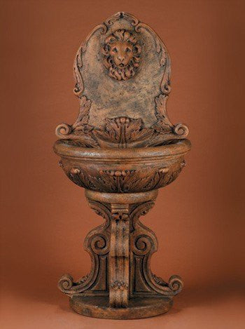 Outdoor wall fountain featuring a classic lion design
