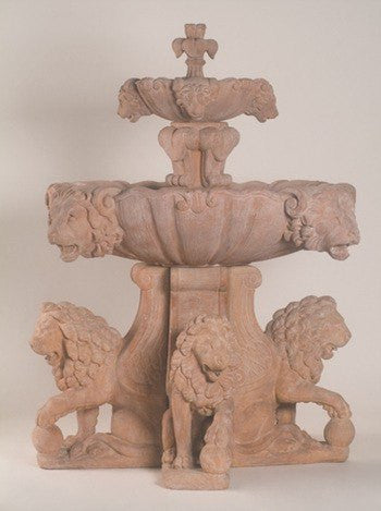 Outdoor water feature with a large lion design for a pond
