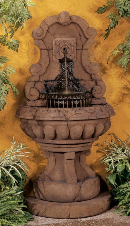 Outdoor wall fountain with scroll design