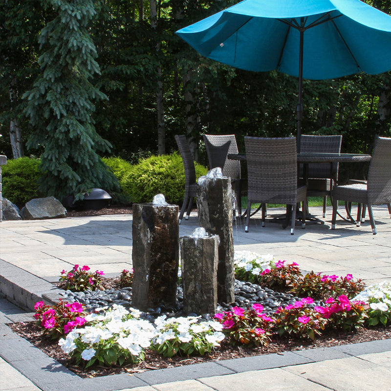 Outdoor water feature made from a hollowed basalt column