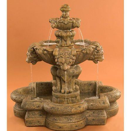 Small tiered garden fountain with lion detail in quatrefoil basin