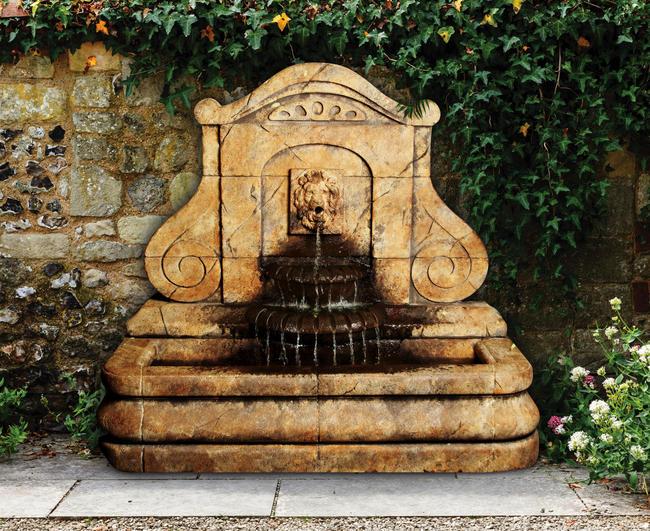 Outdoor wall fountain with lion design