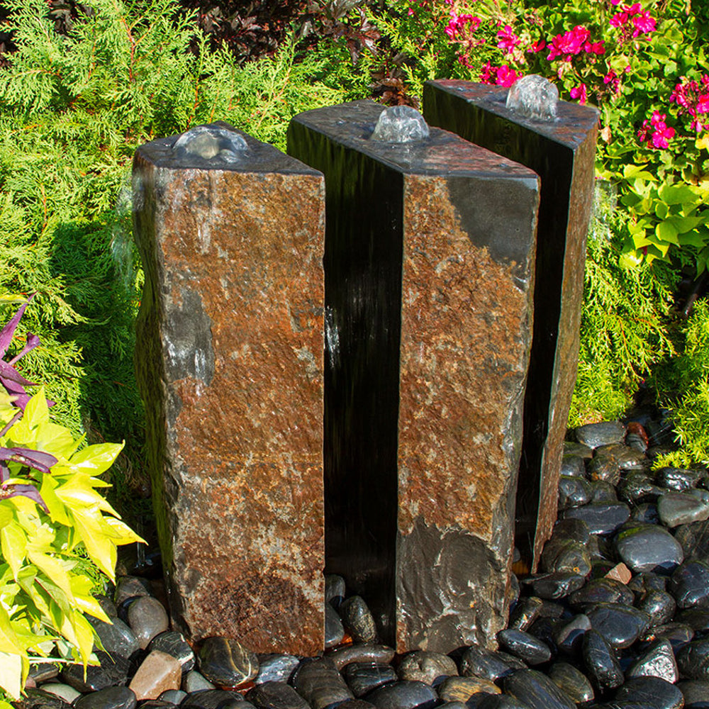Outdoor fountain made of polished basalt stone, 36 inches tall, with a triple split design, sold as a 3 piece set.
