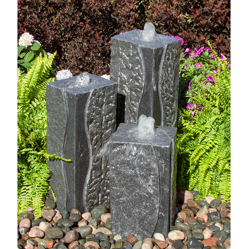 Image of a polished corner triple granite stone fountain.
