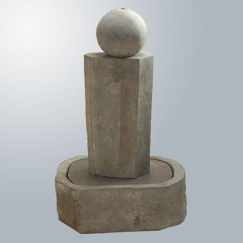 Short rock pillar fountain with a ball on top