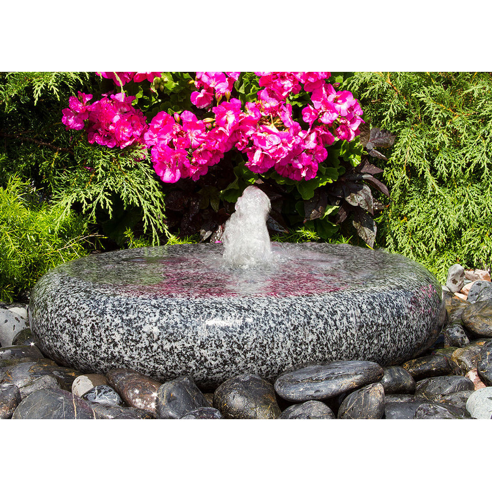 Image of a smooth round granite stone fountain