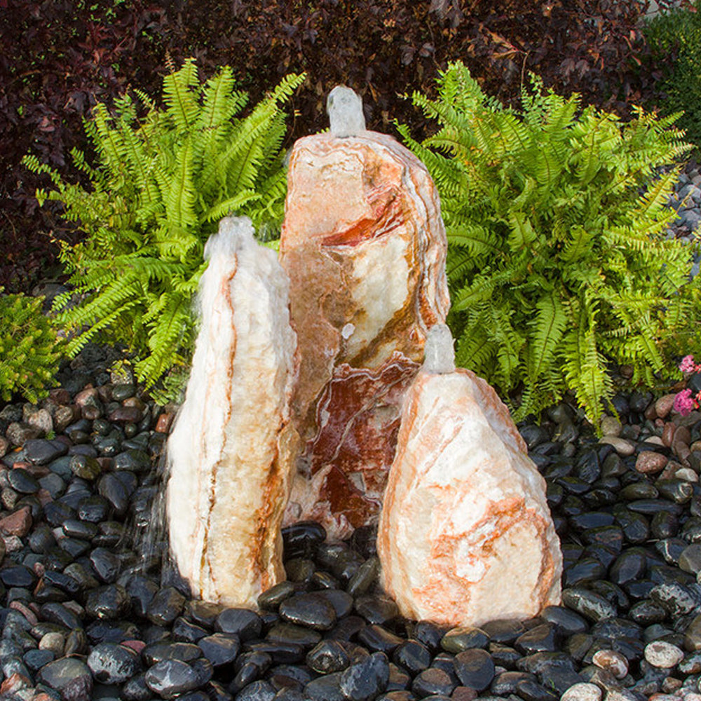 Chiseled stone fountain with three tiers