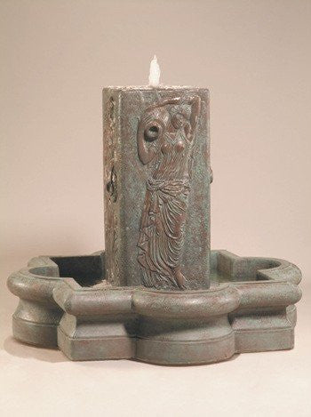 Outdoor fountain featuring a water maiden figure in a quatrefoil shaped basin.