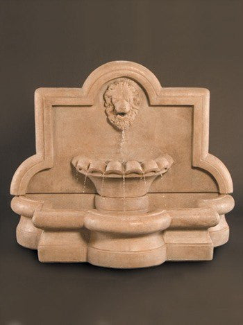 Outdoor wall water fountain featuring a large lion and quatrefoil design