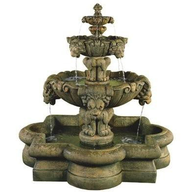Outdoor water fountain with lion accents and tiered design in a quatrefoil shaped basin