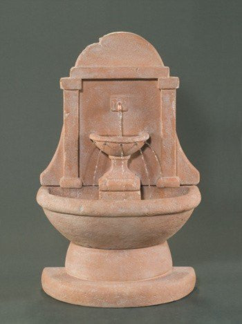 Short outdoor wall fountain with water flowing