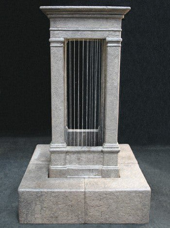 Tall outdoor water feature with curtain rain effect in an old world style