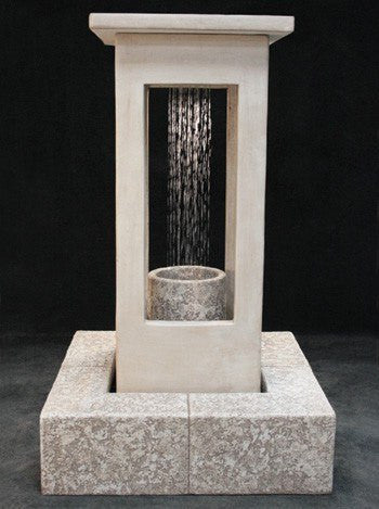 Tall outdoor water feature with smooth center and column design