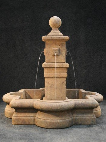 Outdoor water fountain in quatrefoil basin