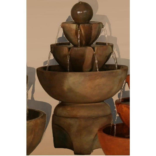 Low stone fountain with multiple vessels on a pedestal base