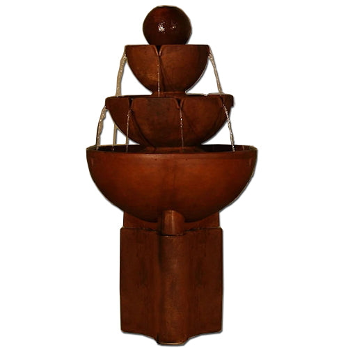 Tall stone fountain with multiple vessels on a pedestal