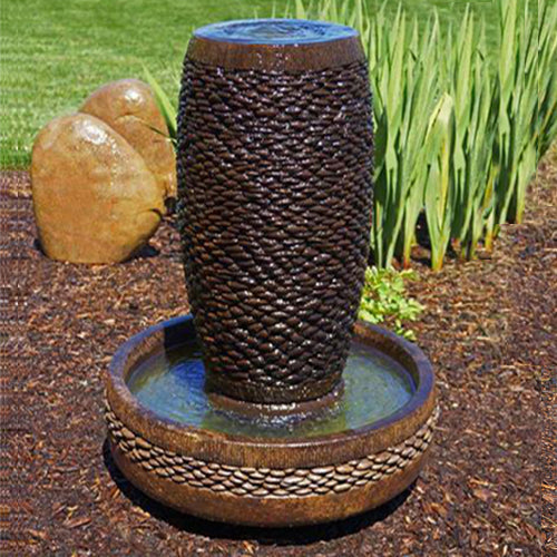 Image of a slender shimmering stones fountain.