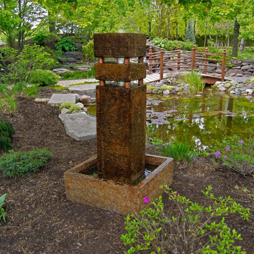 Image of a tall stone water feature.