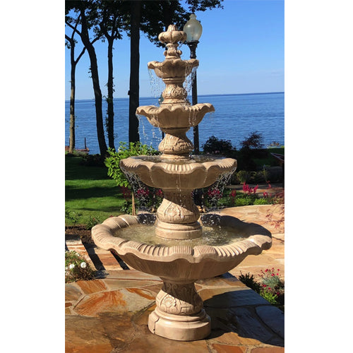 Image of a large outdoor fountain with four levels, designed in a classic style.