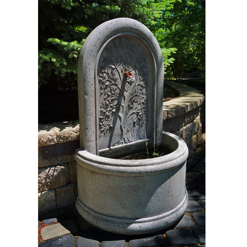Garden fountain featuring a tree of life design