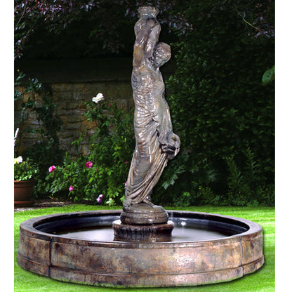 Outdoor water feature with a woman statue in a pool