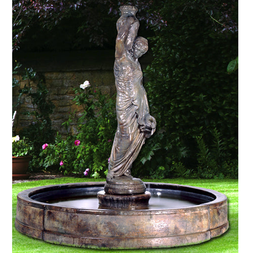 Outdoor water feature with a woman statue in a pool