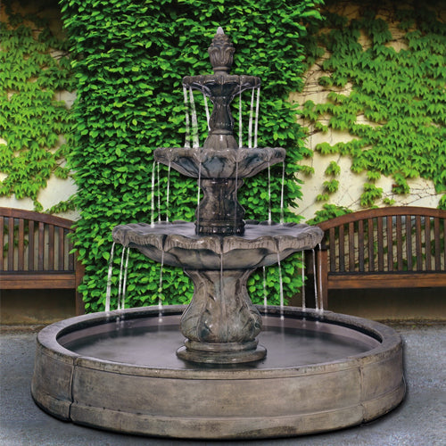 Outdoor fountain with finial design in a pool setting
