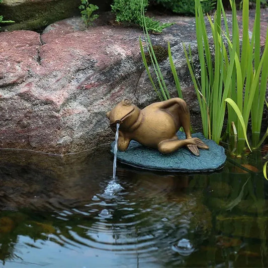 Image of a frog spitter on a lily pad.
