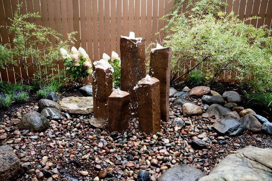 Image of five decorative columns resembling basalt stone