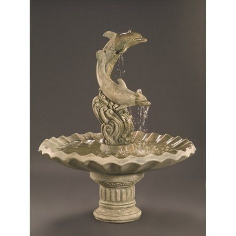 Cast stone garden fountain featuring dolphins and a shell bowl