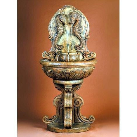 Outdoor wall fountain featuring a seahorse design