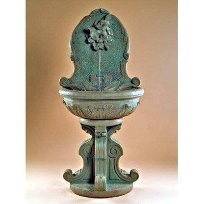 Outdoor wall fountain featuring a hummingbird design