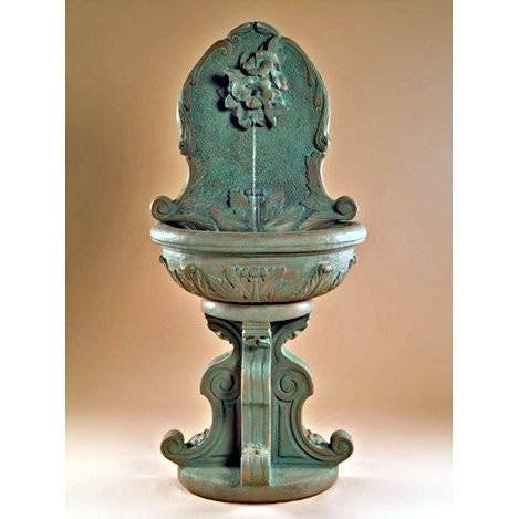 Outdoor wall fountain featuring a hummingbird design