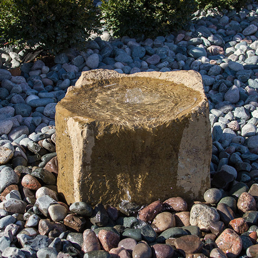 Stone garden fountain with cascading water feature