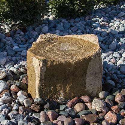 Stone garden fountain with cascading water feature