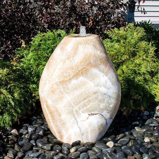 Yellow onyx stone fountain with almond shape