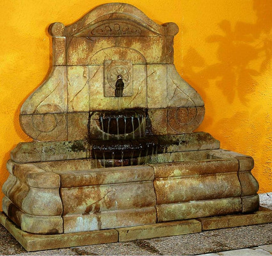 Outdoor wall fountain with rosette design