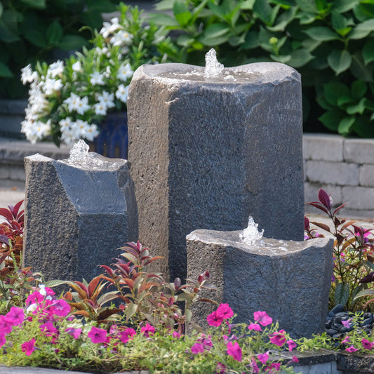 Image of a triple stone fountain designed as a bird bath.