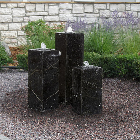 Image of a black granite triple tower stone fountain
