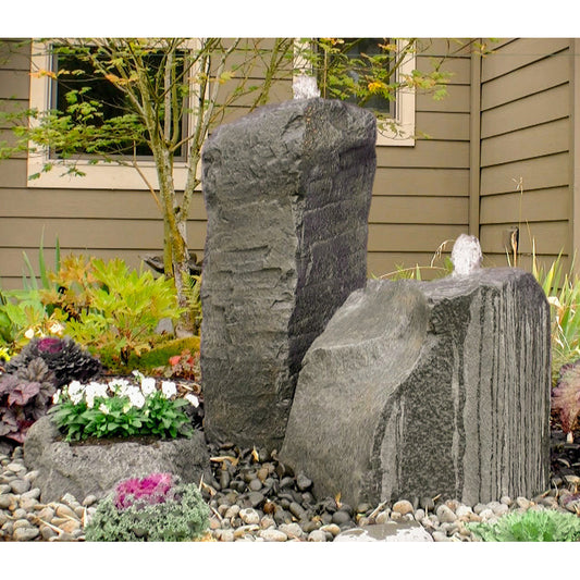 Image of a cascading double stone fountain with an accent planter.