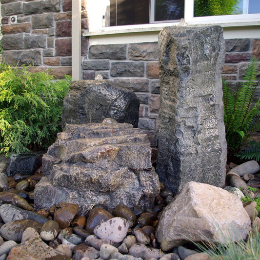 Outdoor fountain with three cascading stone tiers
