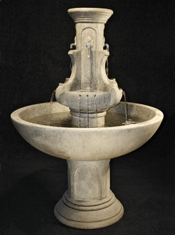 Cast stone garden fountain with fleur de lis design for a courtyard
