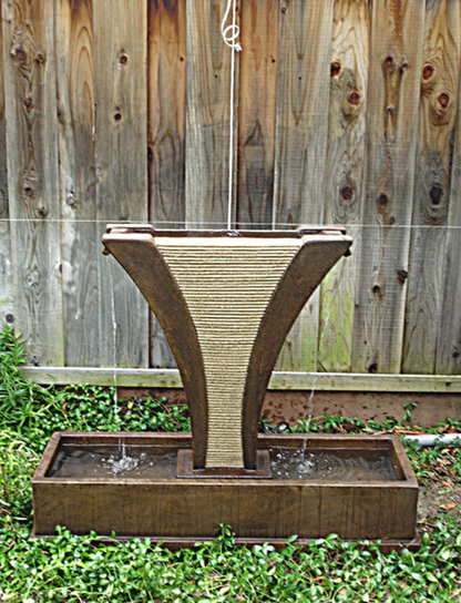 Outdoor water feature with cascading side spills