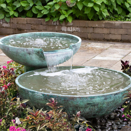 Image of a stone bowl fountain with two spillways