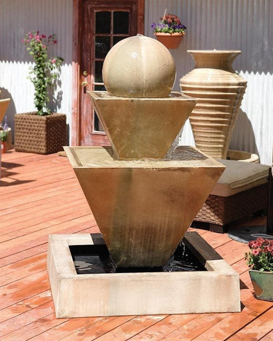 Outdoor water feature with two angled spouts and a sphere accent