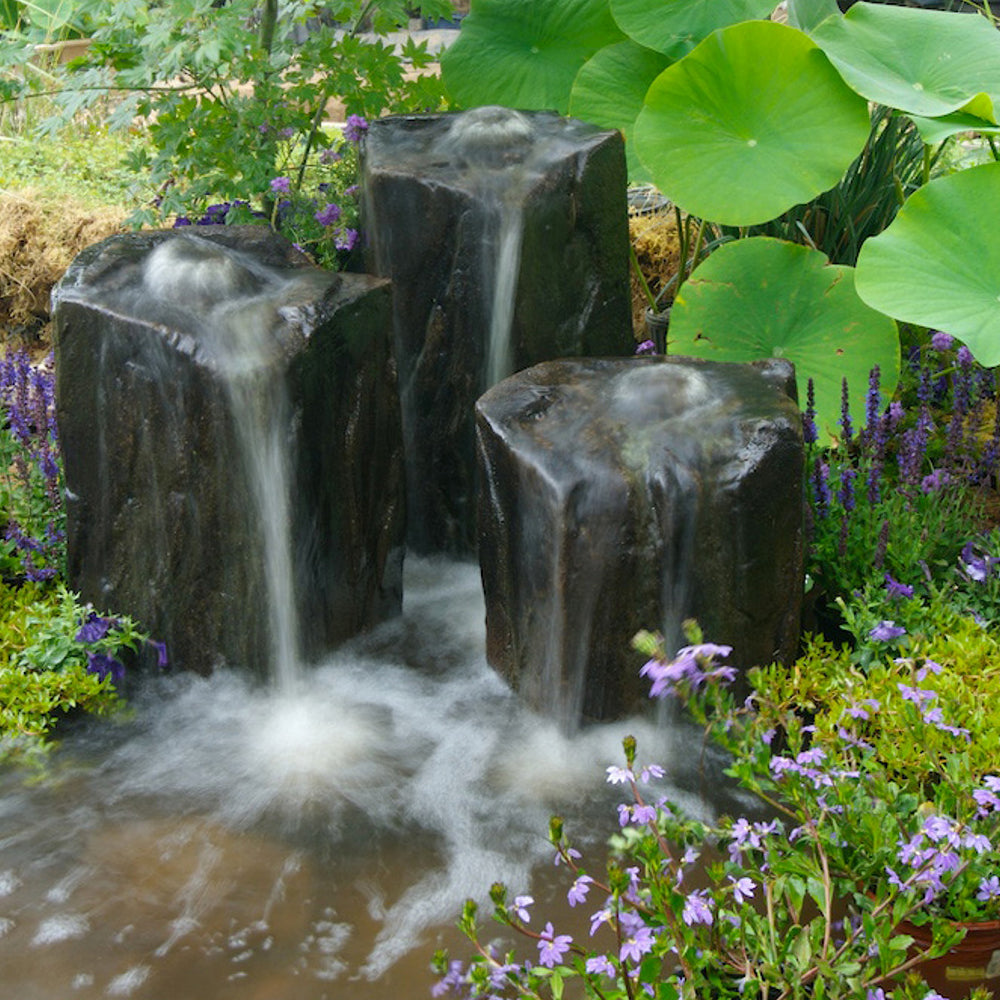 Outdoor fountain with three rock columns