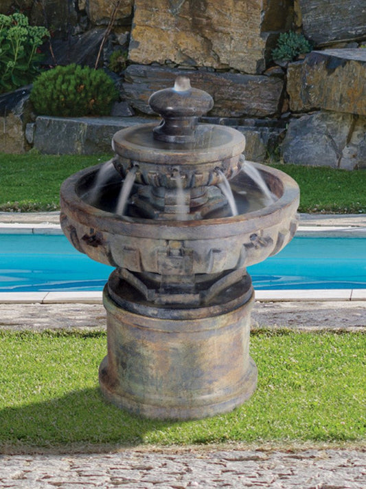 Image of a small tiered fountain with a regal design.