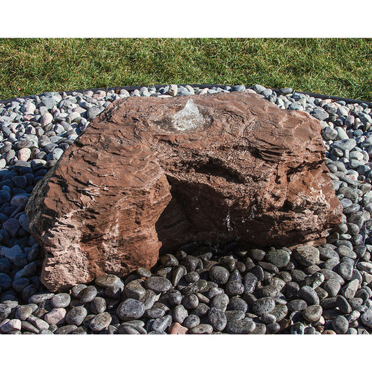 Outdoor stone water feature with cascading falls