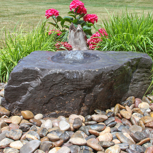 Image of a medium stone outdoor fountain designed as a bird bath