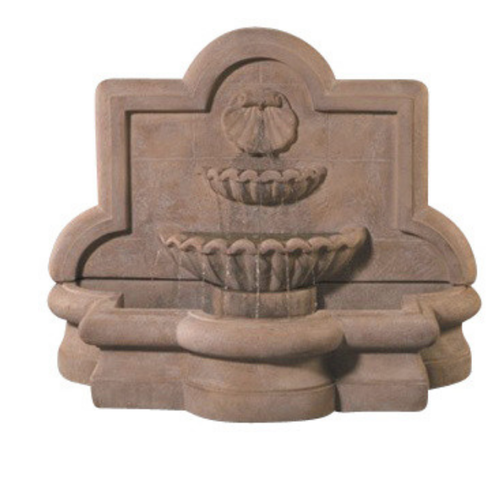 Large outdoor wall fountain with a shell and quatrefoil design